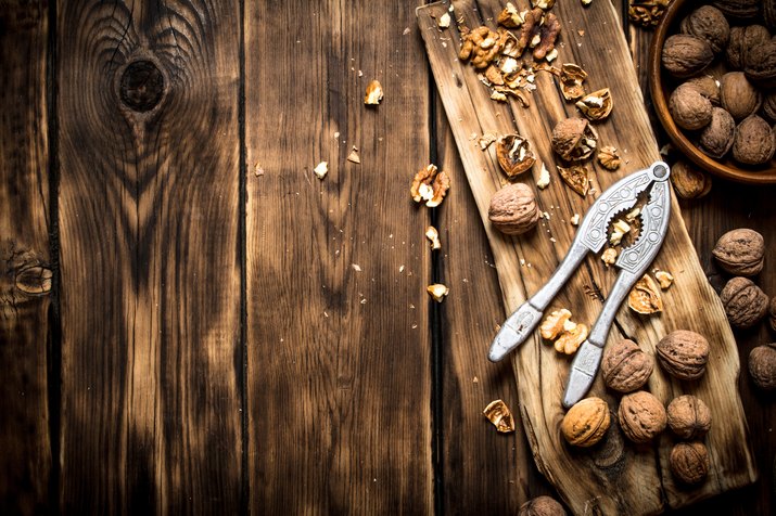 Walnuts with Nutcracker on the Board.