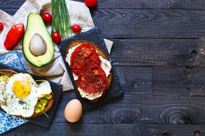 Delicious Tasty Avocado Eggs and Tomato Cheese Toasts