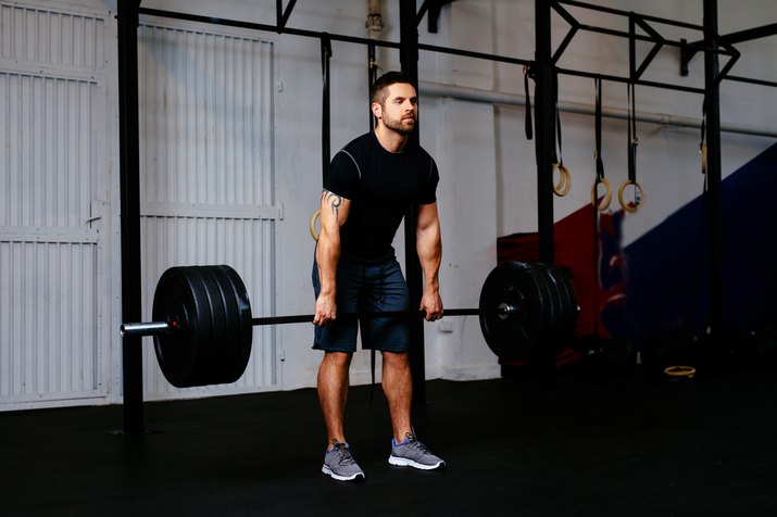 Young man during deadlift workout