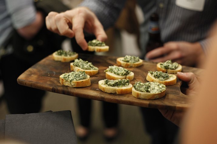 Platter of spinach and artichoke dip served at a party
