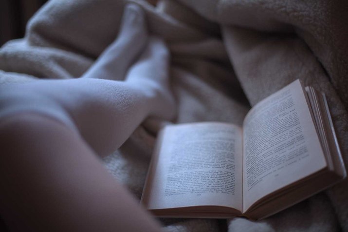 Woman reading before bed.