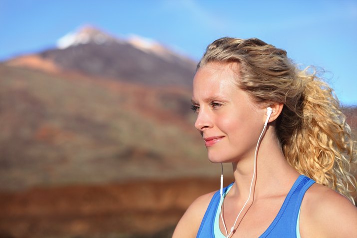woman hiking listens to music