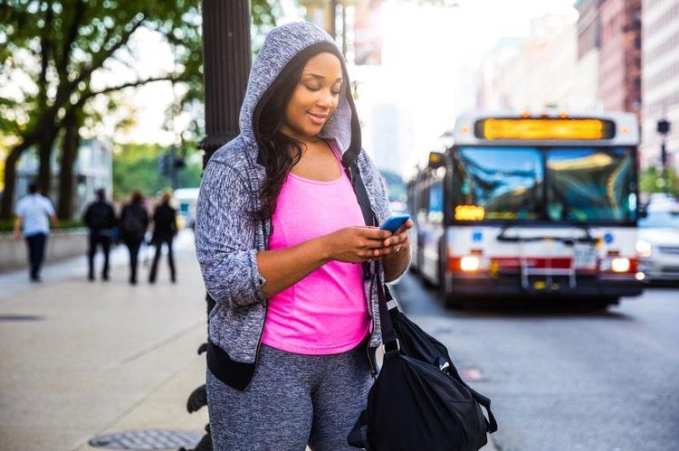 Plus size woman jogging and exercising at the park and walking outdoor in the city streets in Chicago.