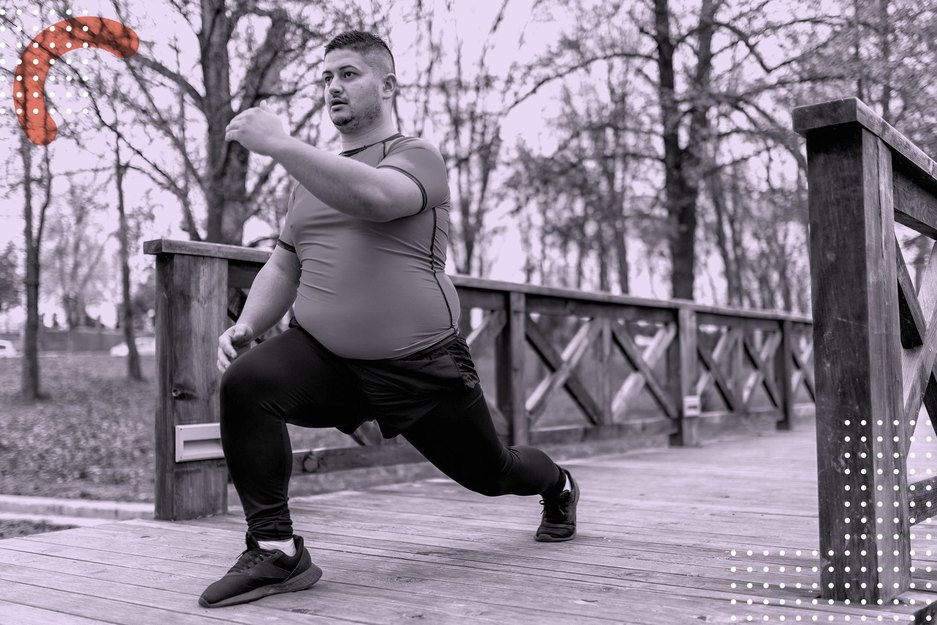 Person in a larger body wearing a t shirt and joggers does a lunge outdoors as part of the 5 Minutes of Movement Challenge