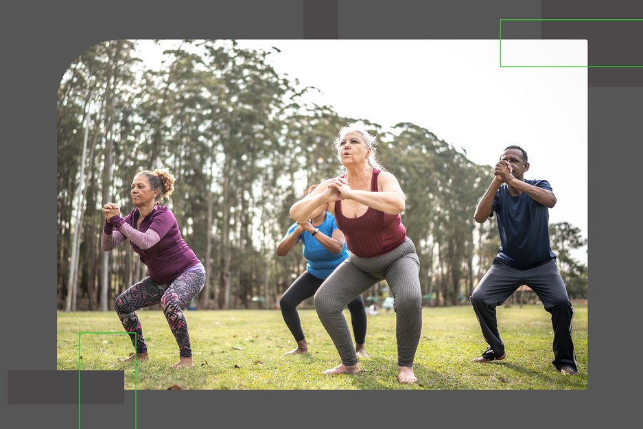 a group of adults of various ages wearing athletic clothing do squats outside as part of a 30-day squat challenge