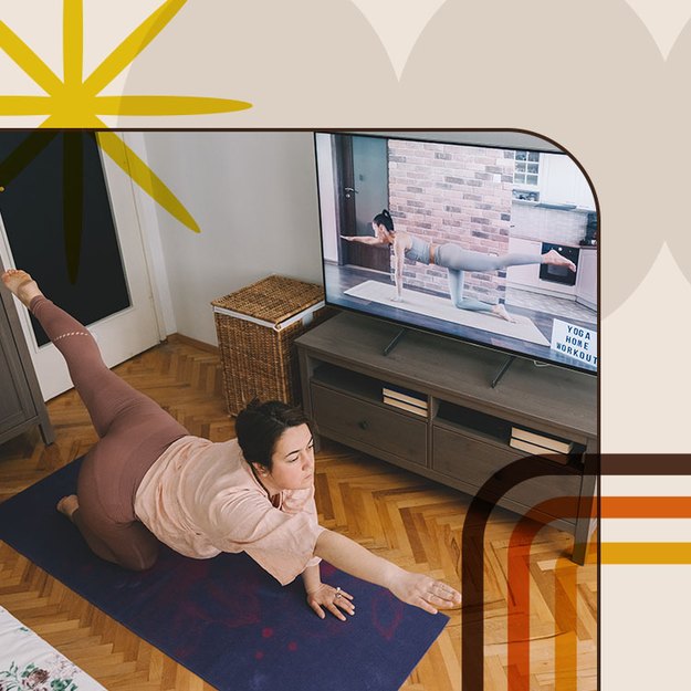 a person does a bird dog exercise on a black yoga mat at home in front of a flat screen tv as part of a 31-day workout video challenge
