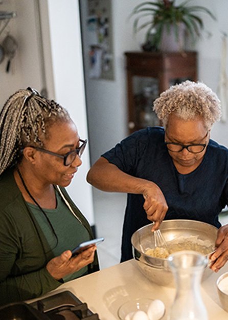 people cooking together as an act of community care