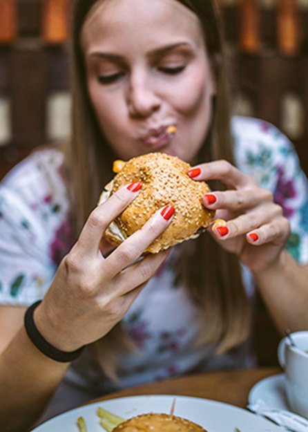 person eating burger
